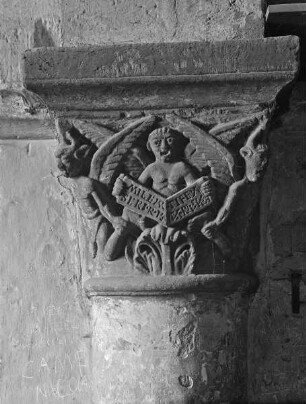 Kapitell: Satan, von zwei geflügelten Teufeln umgeben, hält ein Spruchband mit der Verurteilung des Wucherers