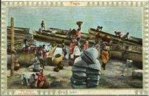 Afrikaner mit Booten in Togo