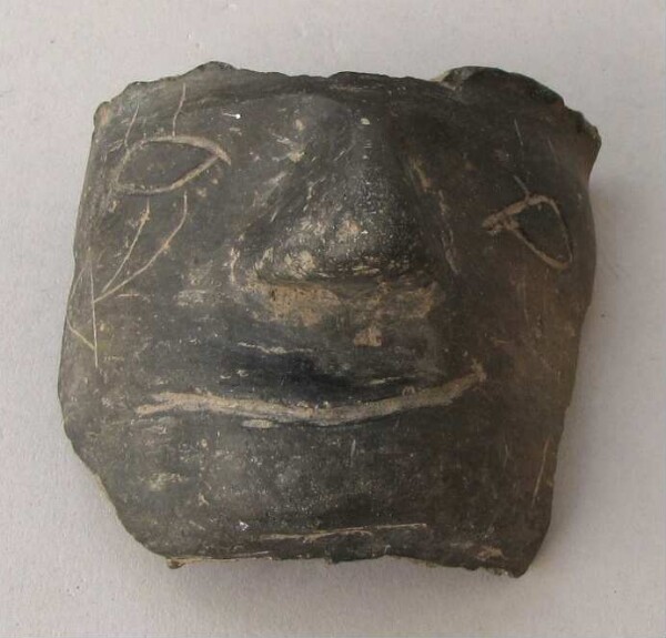 Fragment of a clay vessel