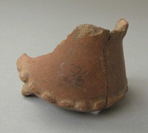 Fragment of a clay vessel