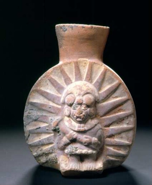 Relief: anthropo-zoomorphic figure with rays