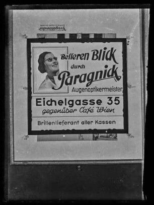 Werbung des Augenoptikermeisters Paragnick, Eichelgasse 35, gegenüber Cafe Wien