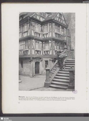 Wertheim. Haus der vier Gekrönten, so genannt nach den vier Konsolfiguren, die über dem steinernen Erdgeschoß die Übertragung des reichen Fachwerk-Oberbaues tragen
