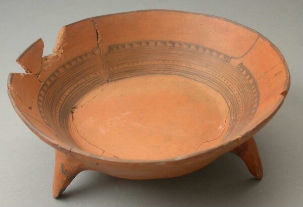 Three-footed clay bowl