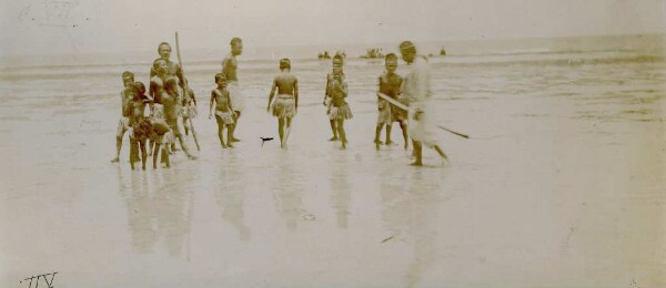 "Men loading copra over the reef, Nauru"