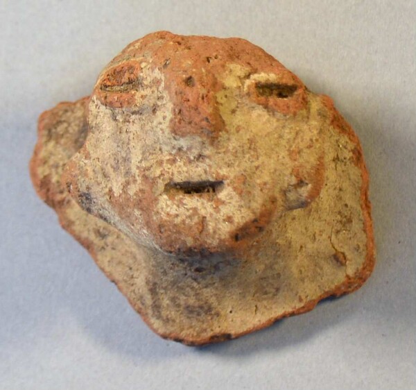 Clay head (fragment of a burial urn)