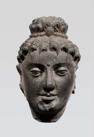 Kopf eines Buddha mit Korkenzieherlocken