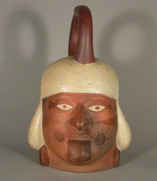 Figure vessel with stirrup spout