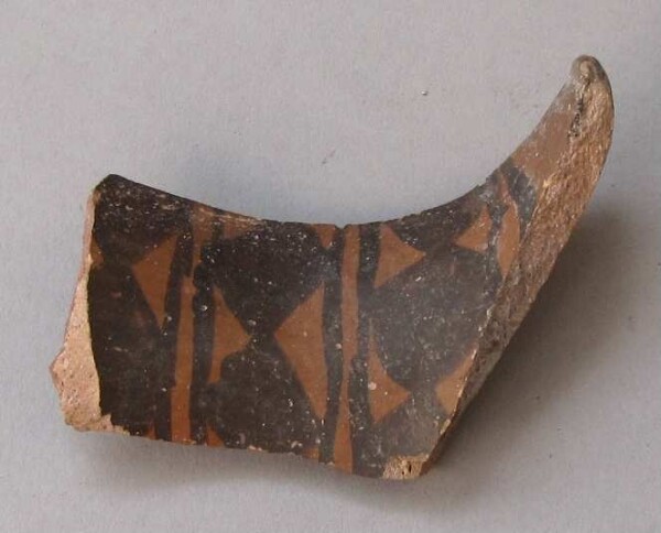 Fragment of a clay vessel