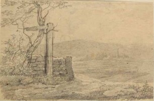 Landschaft mit Mauerrest und altem Schild