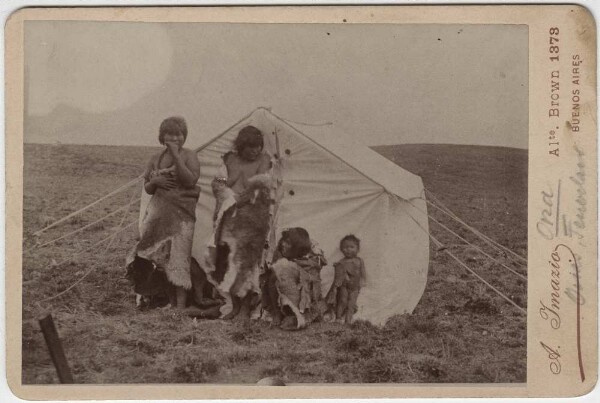 Selk'nam (Ona) in front of a tent in Tierra del Fuego