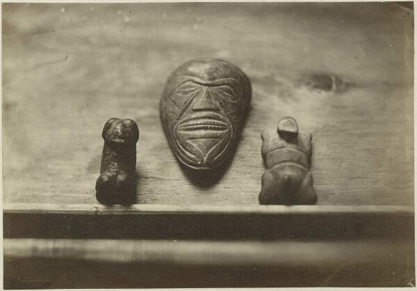 Two anthropomorphic stone figures and a stone mask