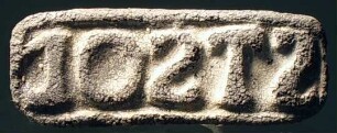 Rechteckiger Stempel mit lateinischer Inschrift: ST SOD (?)