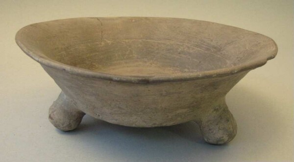 Three-footed clay bowl