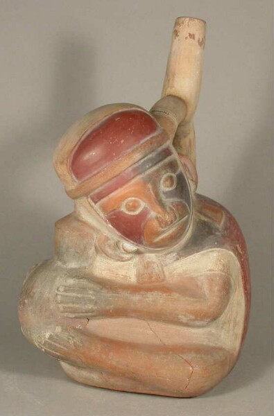 Figure vessel with stirrup spout