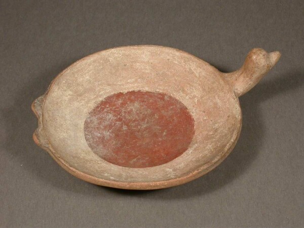 Flat clay bowl with bird's head