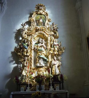 Seitenaltar mit dem heiligen Joseph mit Kind, flankiert von den Heiligen Franz Xaver und Ignatius