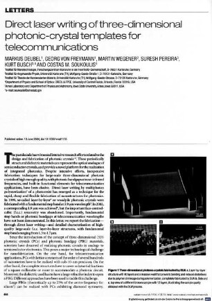 Direct laser writing of three-dimensional photonic-crystal templates for telecommunications