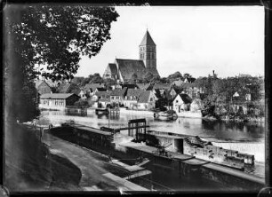 Rheine. Blick vom östlichen (rechten) Ufer der Ems auf das Emswehr und die Innenstadt mit Stadtkirche St. Dionysius