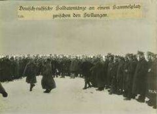 Deutsche und russische Soldaten tanzen zwischen den Stellungen bei Dünaburg