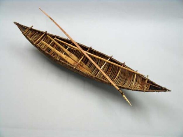 Model of a bark canoe with accessories