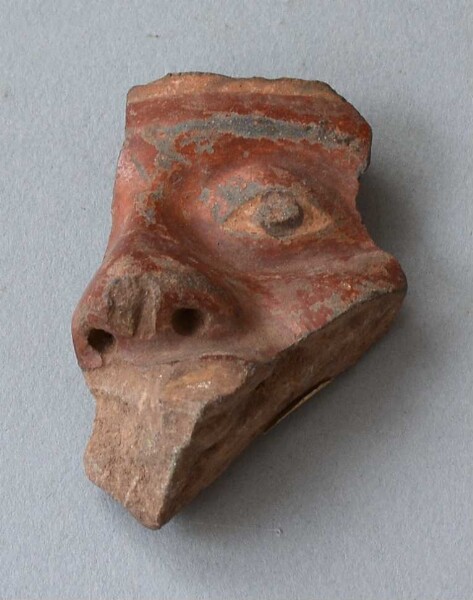 Clay head (vessel fragment)