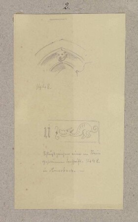 Figürlich verzierter Scheitel einer gotischen Maueröffnung und das Schlußzeichen einer in Stein gehauenen Schrift in Amorbach