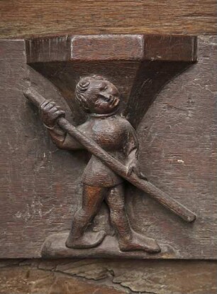 Südliches Chorgestühl — Männliche Figur mit Stake
