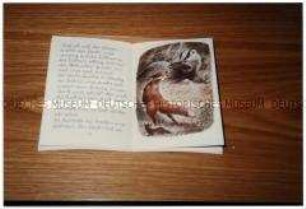 Aufgeschlagenes Kinderbuch (Altersgruppe bis 14)