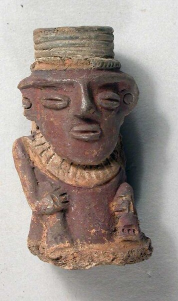 Figurine en argile (fragment de récipient)