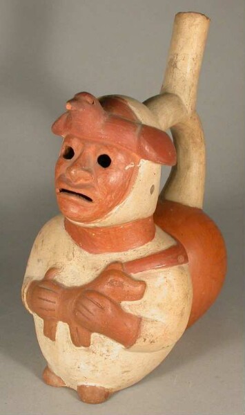 Standing anthropomorphic figure with animal in arms