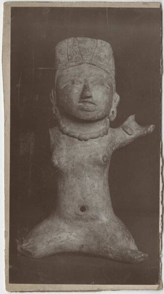 Clay figure of a seated woman