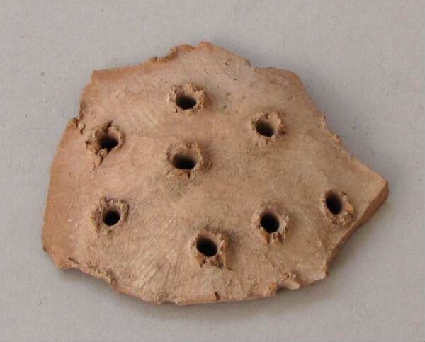 Fragment of a clay vessel