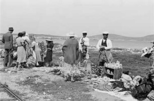 Reisefotos Griechenland. Delos (Insel). Touristen und Souvenirverkäufer