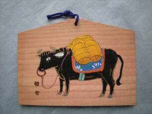 Ema: Rind mit Reissäcken