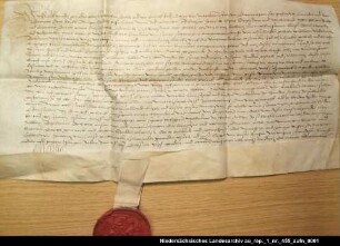 Herzog Carl von Geldern nimmt den Junker Balthasar von Esens gegen Graf Enno II. von Ostfriesland in seinen Schutz und belehnt ihn mit der Herrlichkeit Esens Anhängendes Siegel beschädigt erhalten; Unterschrift