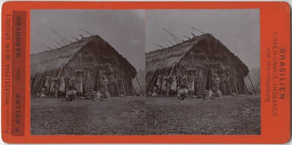 Groupe de personnes devant une cabane