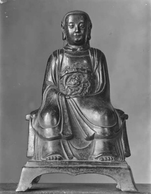 Sitzende Figur