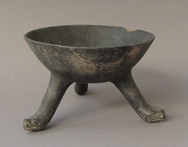 Three-footed clay bowl