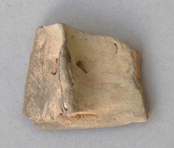 Fragment of a clay vessel decoration