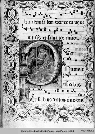 Textseite mit Bordürenrahmen und historisierter Initiale P(uer natus est), darin Geburt Christi - Diurno Domenicale