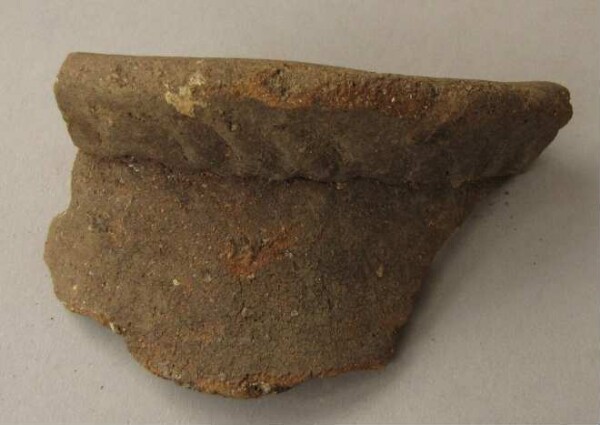 Rim piece of a clay vessel