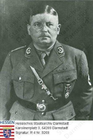 Röhm, Ernst (1887-1934) / Porträt in SA-Uniform, stehend, Halbfigur