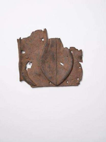 Bronze plate with sword and crescent, fragment