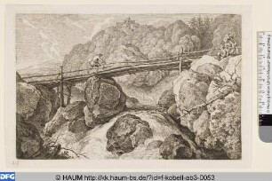 Brücke zwischen Felsen über einen Gebirgsbach