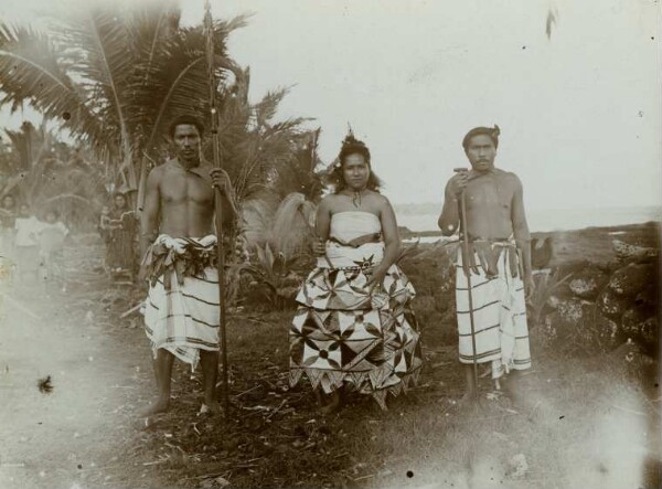 "Woman with bark cloth, right-hand man with long staff, left-hand man with skilfully carved spear."