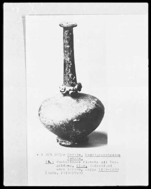 Dunkelbraune Flasche mit Vergoldung