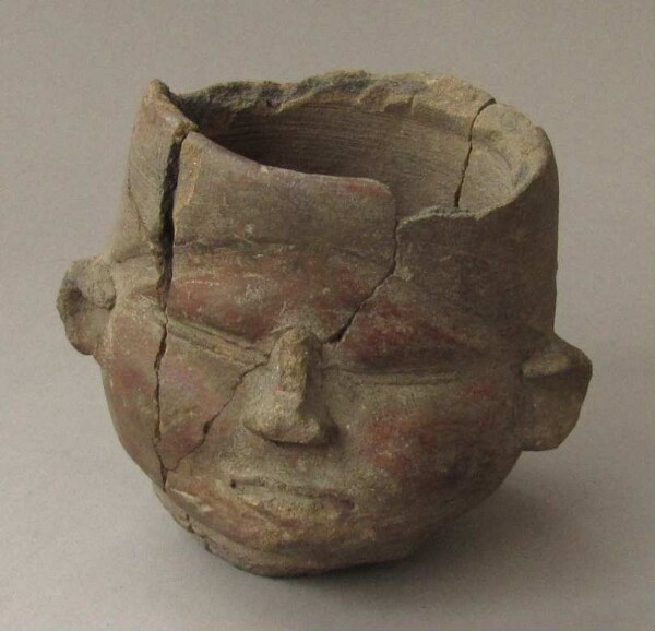 Clay head (vessel fragment)