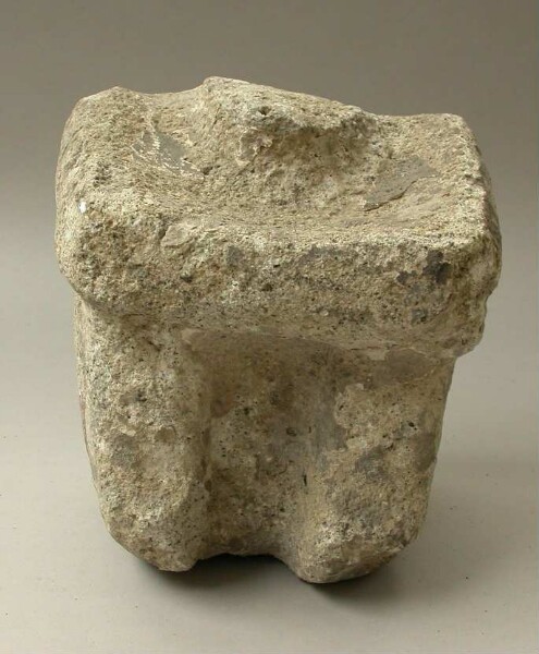 Lower part of a stone figure