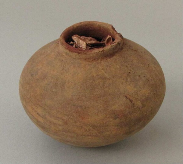 Clay pot filled with red dye